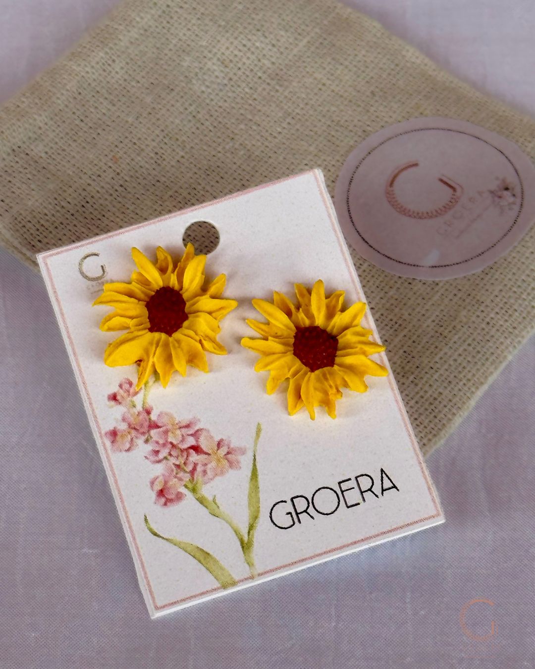 Bright yellow sunflower stud earrings handcrafted from polymer clay