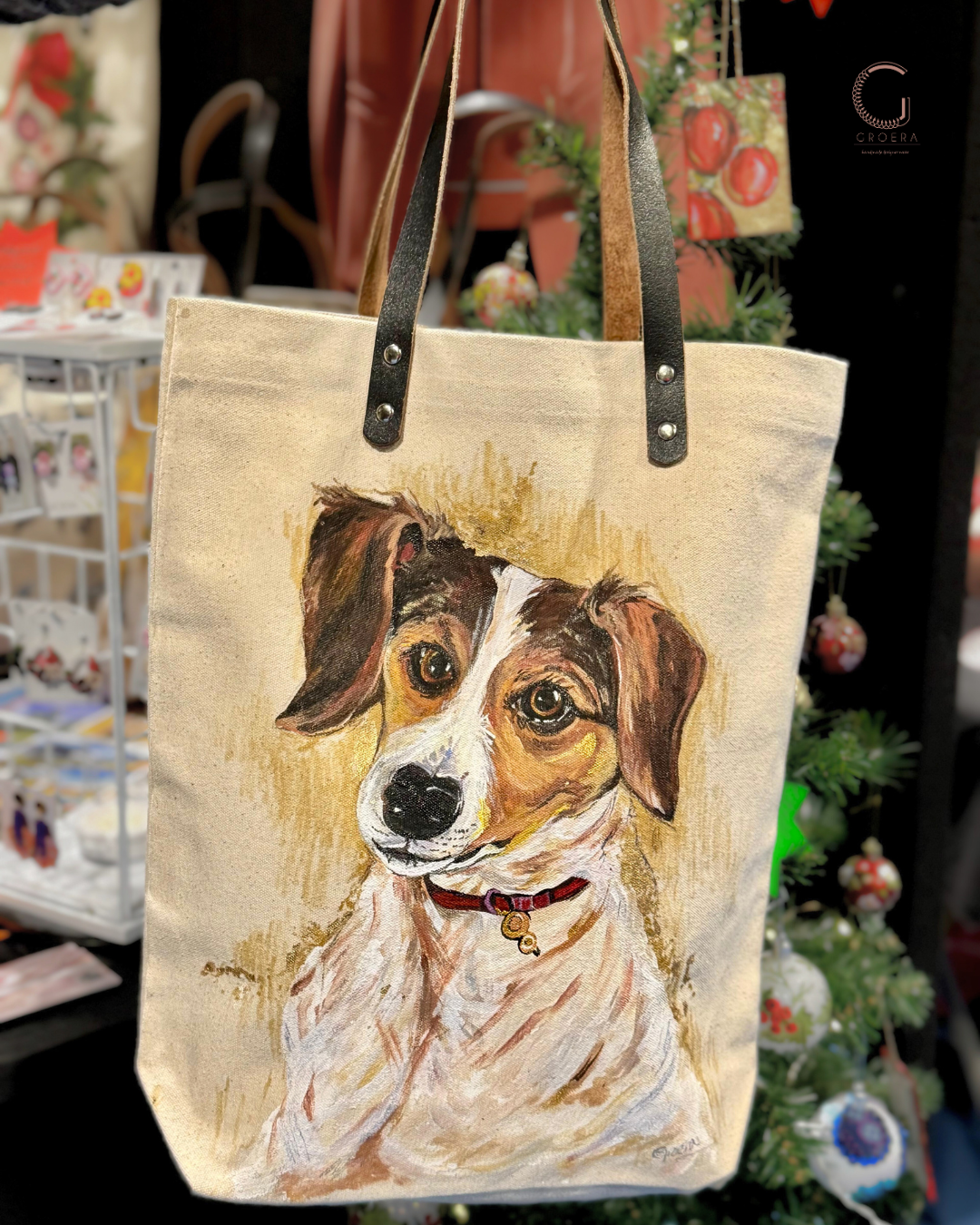 Tote bag with a dog painting on a store shelf