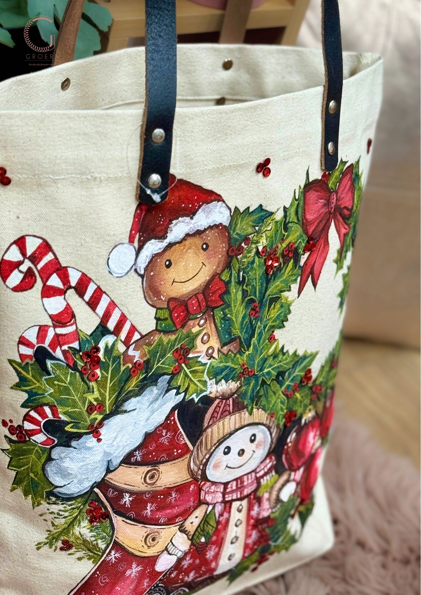 Christmas-themed tote bag with gingerbread man and snowman design.